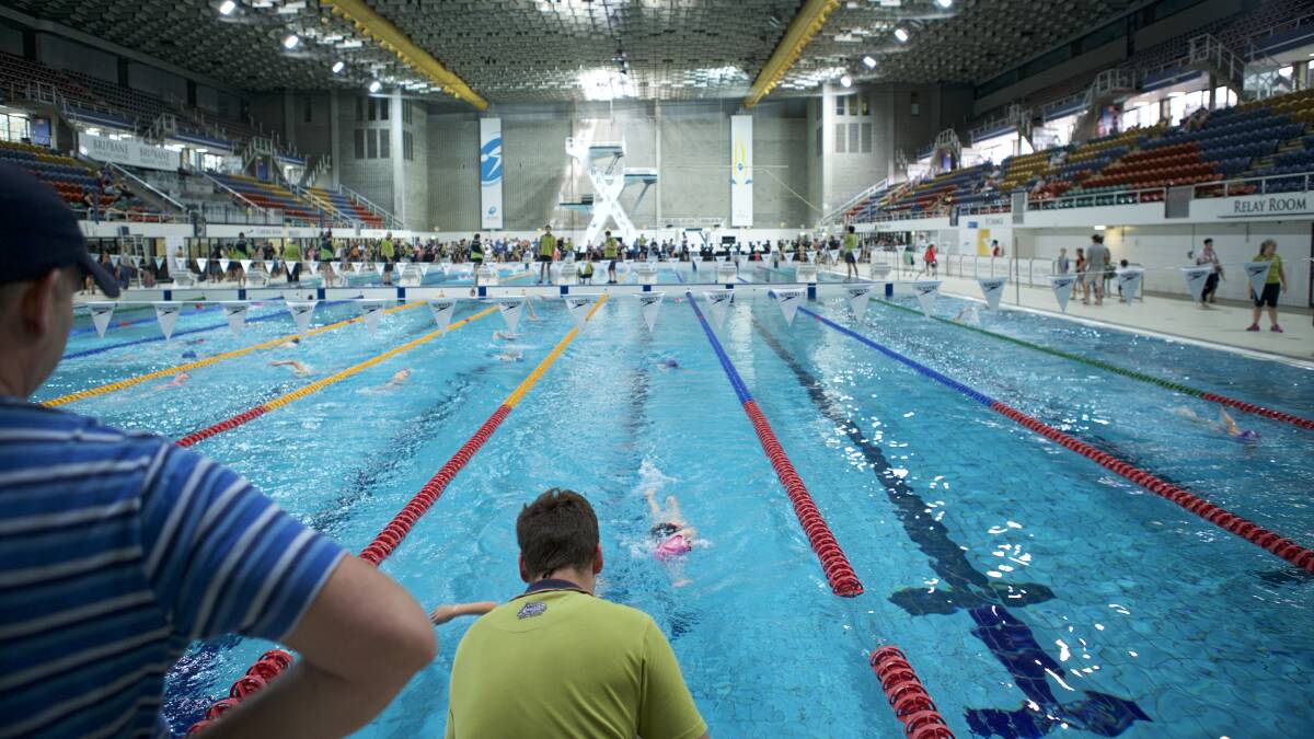 JUST KEEP SWIMMING: Hundreds of little achievers take to the pool for the day swimming the 1km challenge at their own pace.