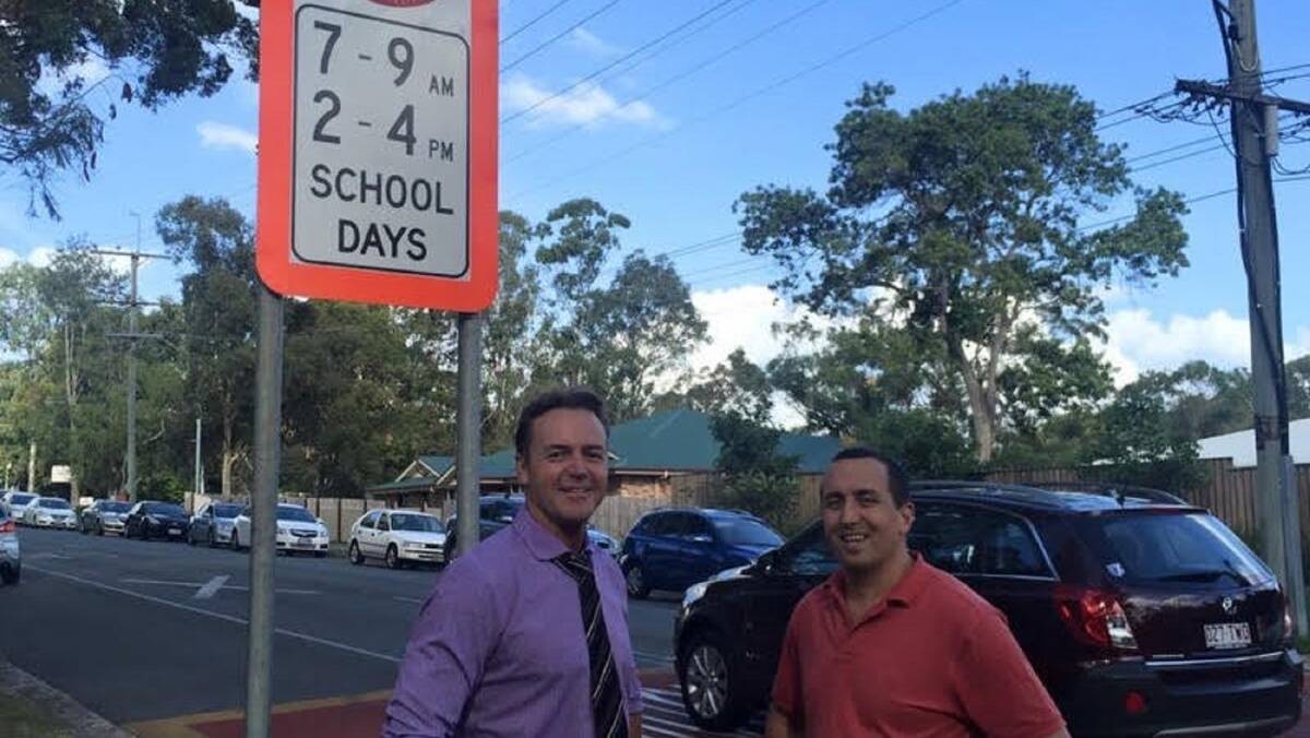 Capalaba MP Don Brown with Birkdale South principal Craig Douglas in front of one of the flashing signs.