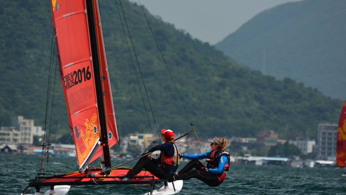 GIRL POWER: Haylie Andrews and Millie MacFarlane contest the Women's Division of the  World Hobie Cat Championships.