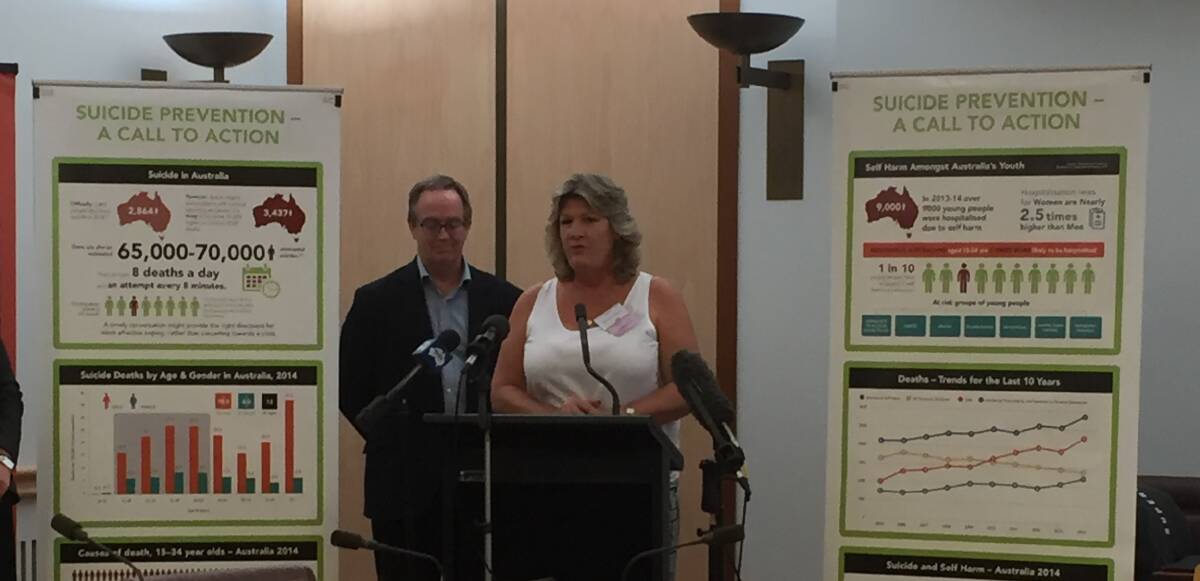 Professor John Mendoza with Capalaba mum Kerrie Keepa ask politicians in Canberra to sign their pledge to do whatever they can to keep the suicide rate down. 