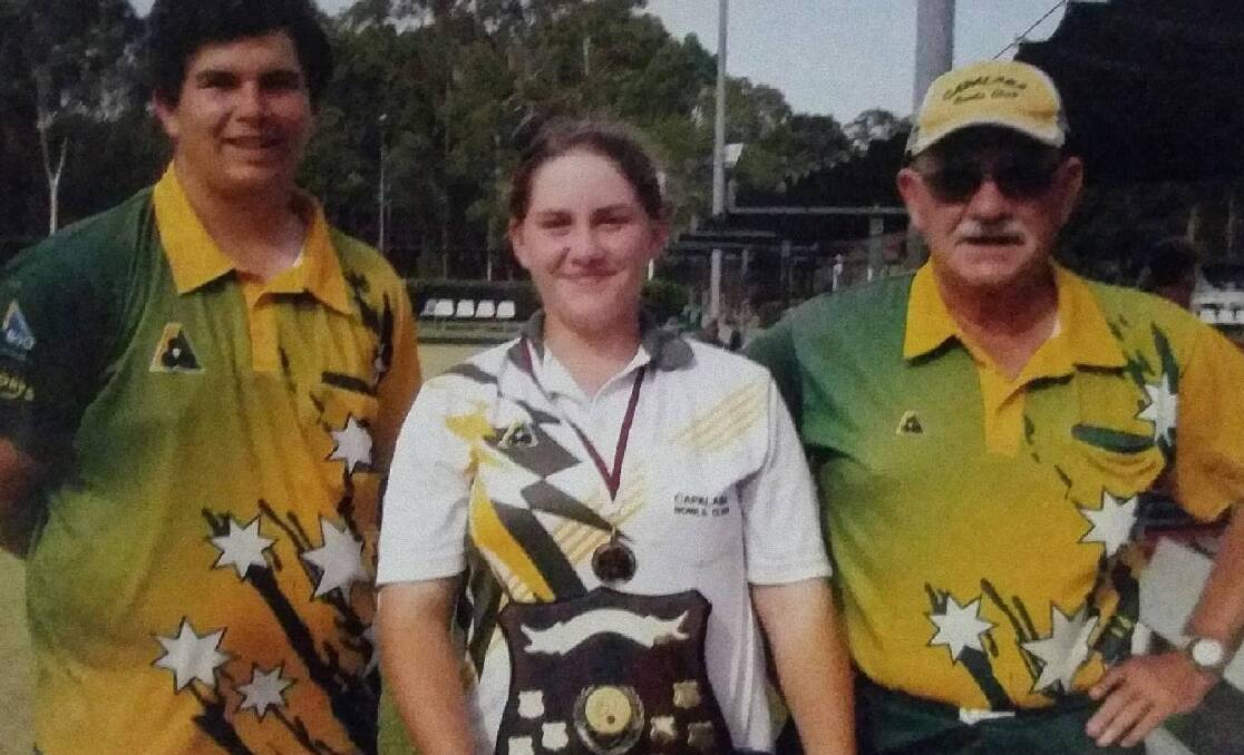 BOWLING CHAMP: Russell Island's Zayah Morgan, centre, overcame adversity to become this year's under 15 state champion lawn bowler. She got some help from cousin Kalib, left, and grandfather Denis Morgan. 
