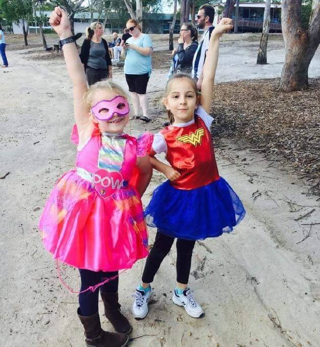 Scarlet Hartley and Georgia White were superheroes at the walkathon. 