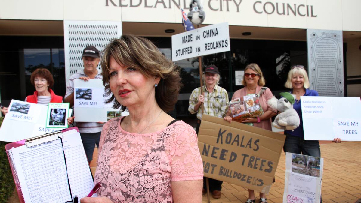 Protester Adelia Berridge with the petition outside Redland City Council chambers. PHOTO: Chris McCormack 