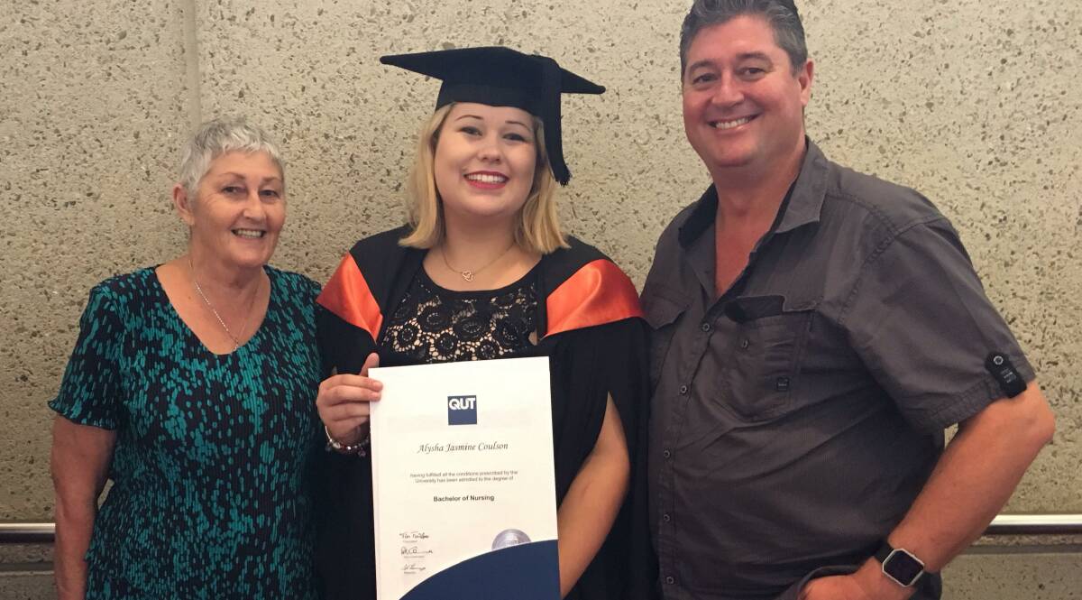 GRADUATE: Alysha Coulson with her father and grandmother at her graduation ceremony last month. Photo: Supplied
