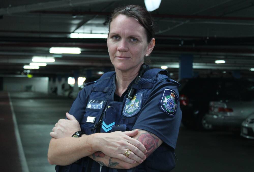 Senior Constable Sam Schofield at the shopping centre car park where she was almost hit by a stolen car.  
