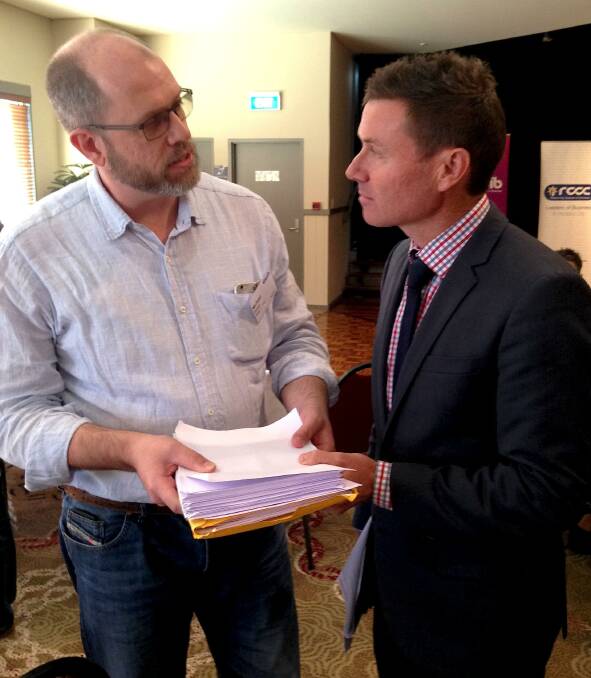 PETITION ARRIVES: Mike Burge presents Bowman MP Andrew Laming with a petition supporting marriage equality.