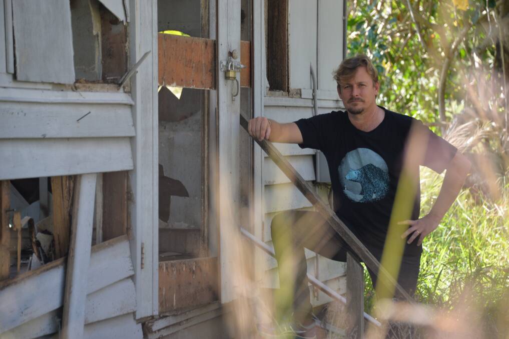 HERITAGE SITE: Cr Paul Bishop at a building on the WWII receiving station site which has been heavily damaged by vandals.