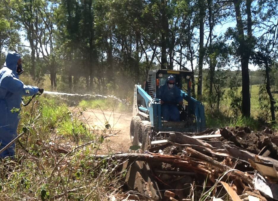 ILLEGAL DUMPING: Council staff clean up asbestos (not at Leslie Harrison) dumped illegally in the Redlands.