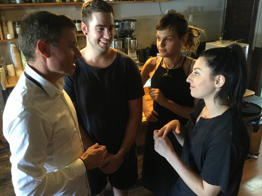 PENALTY TALKS: Andrew Laming meets with local Bean and Leaf staff, dishie Nathan Mobley-Guazzo, cook Suzi Steele and barista Rachell Ambrose.