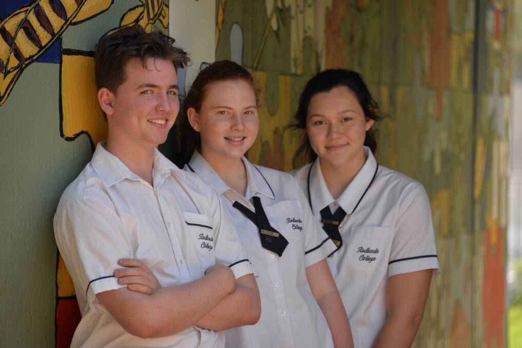ARTY TYPES: Redland College art students Will Langridge, Sophie Thompson and Shannen Ogborne at the artwork they and fellow pupils prepared at the railway tunnel.