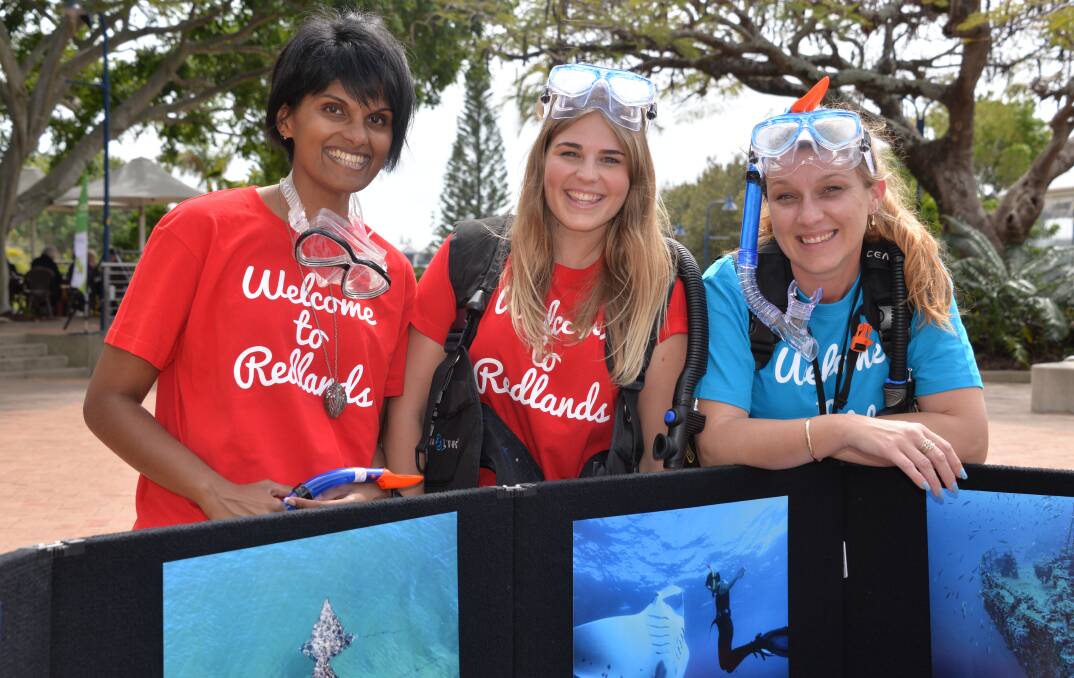 GOGGLES ON: Redland City Council staff Sharon Sebastian, Lucy Dyball and Tanya Clifton help out at a petition signing in Cleveland.