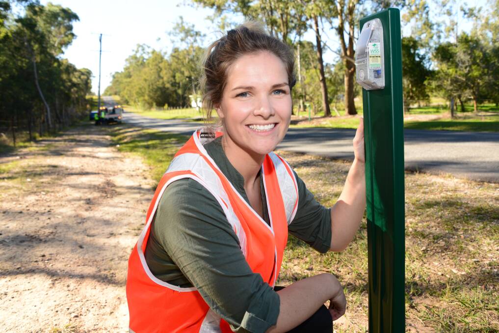 ANIMAL SAFETY: Sallie Gourlay with one of the devices aimed at deterring wallabies from crossing roads when cars are nearby.