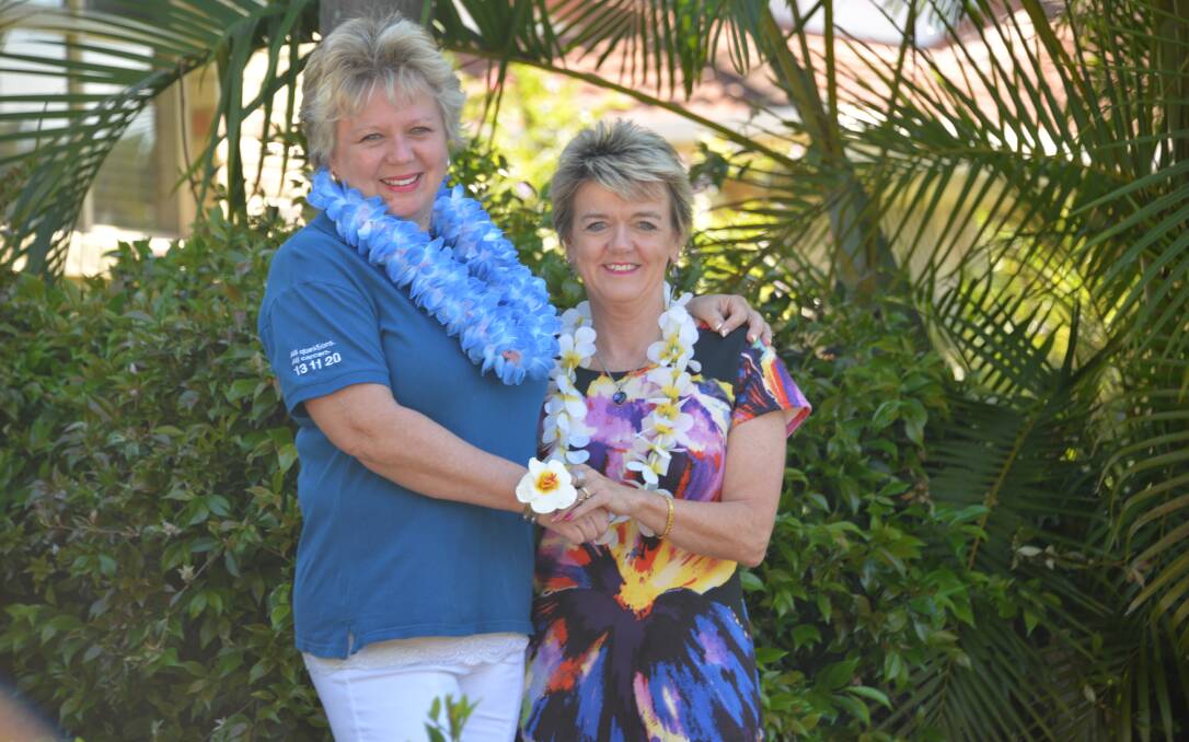 GIRLS' FUN: Tish Henderson and Carol Underwood of Cleveland ready for the girls' tropical theme lunch.