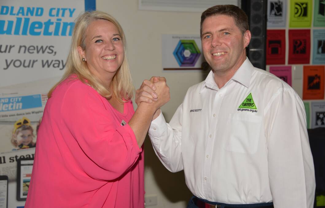 CANDIDATES COME TO GRIPS: Labor's Kim Richards and the Greens Brad Scott tangle at the Redland City Bulletin election forum.