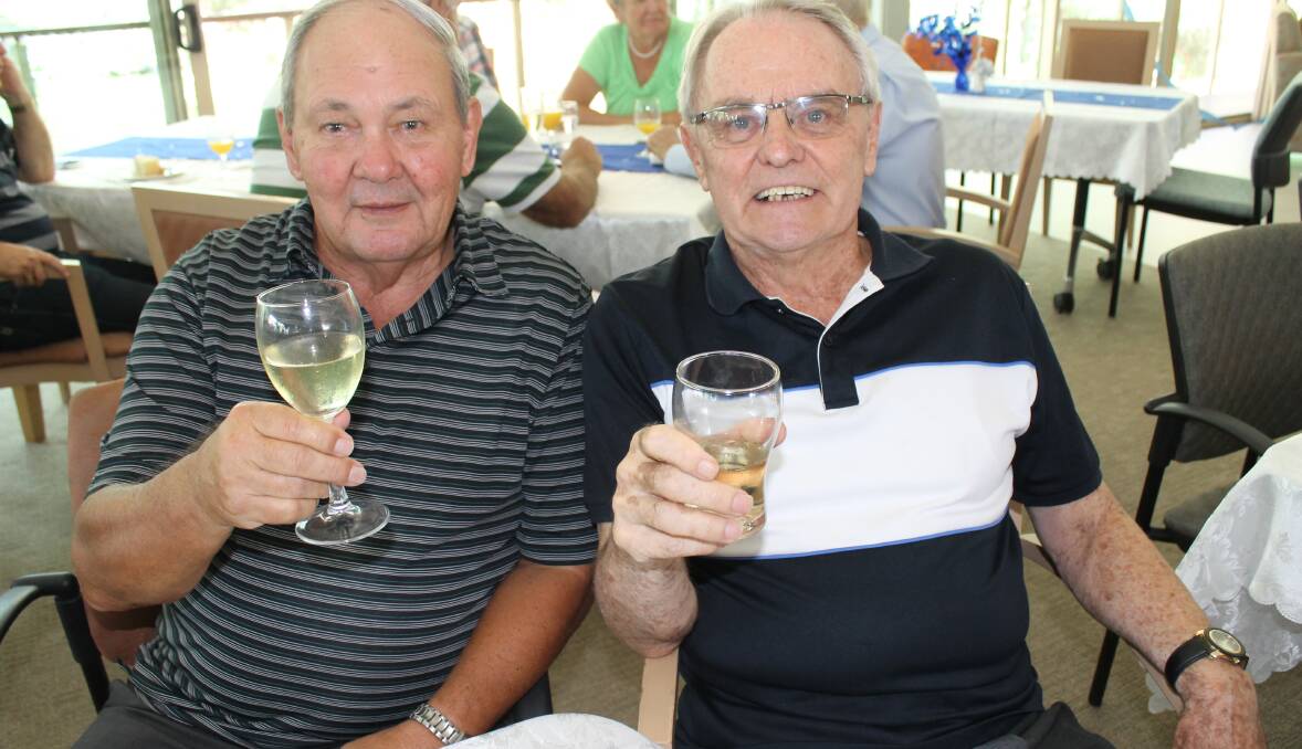 HERE'S CHEERS: Neil Johnstone and Graeme Thompson at the RSL Care Moreton Shores home. The pair were part of the large birthday crowd.