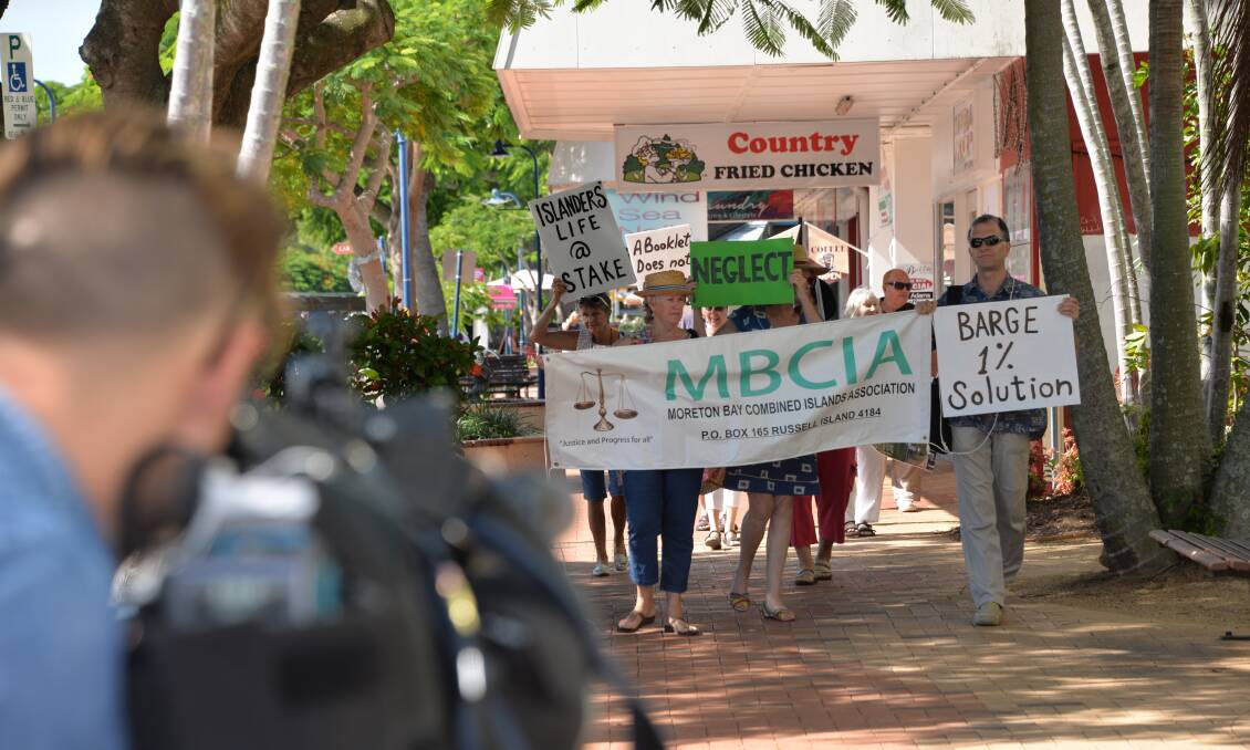 PROTESTERS: Moreton Bay Combined Islands Association members march to Redland City Council chambers last year, protesting about fire protection and other issues. Photo: Brian Williams