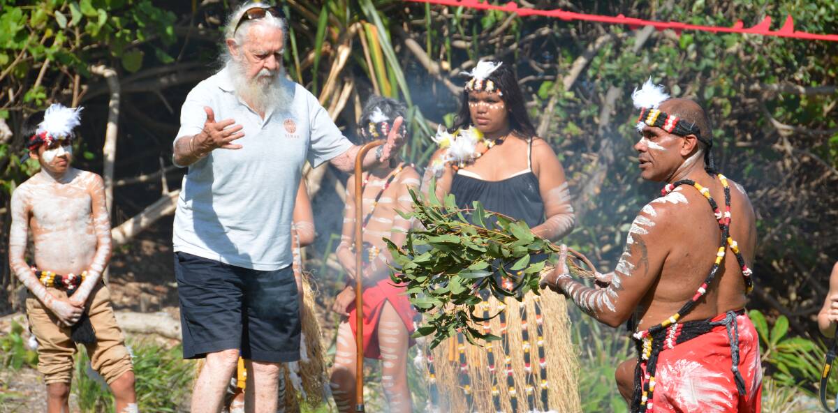 SMOKING: Uncle Bob Anderson and Yulu Burra Ba dancers at a smoking ceremony to welcome the whales.