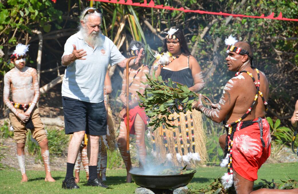 SMOKING: Uncle Bob Anderson and Yulu Burra Ba dancers at a smoking ceremony to welcome the whales.