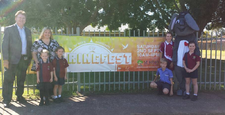 FETE FUN: Cr Lance Hewlett, Carolyn Watson, Gus the school mascot and kids do a little marketing for St Rita's fete on September 2.