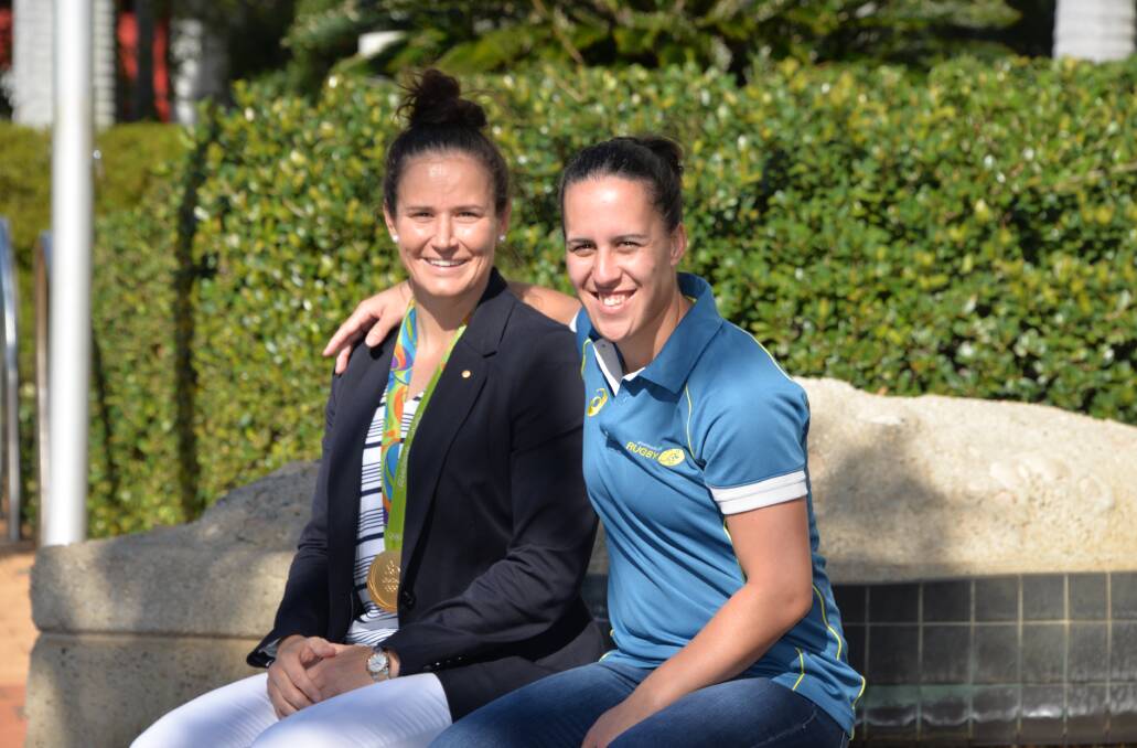 RUGBY STARS: Test captain Shannon Parry and test fly half Fenella "Nella" Hake, with Cheyenne Campbell, are all Redlands Muddies players. The trio head to Ireland next month for the World Cup.