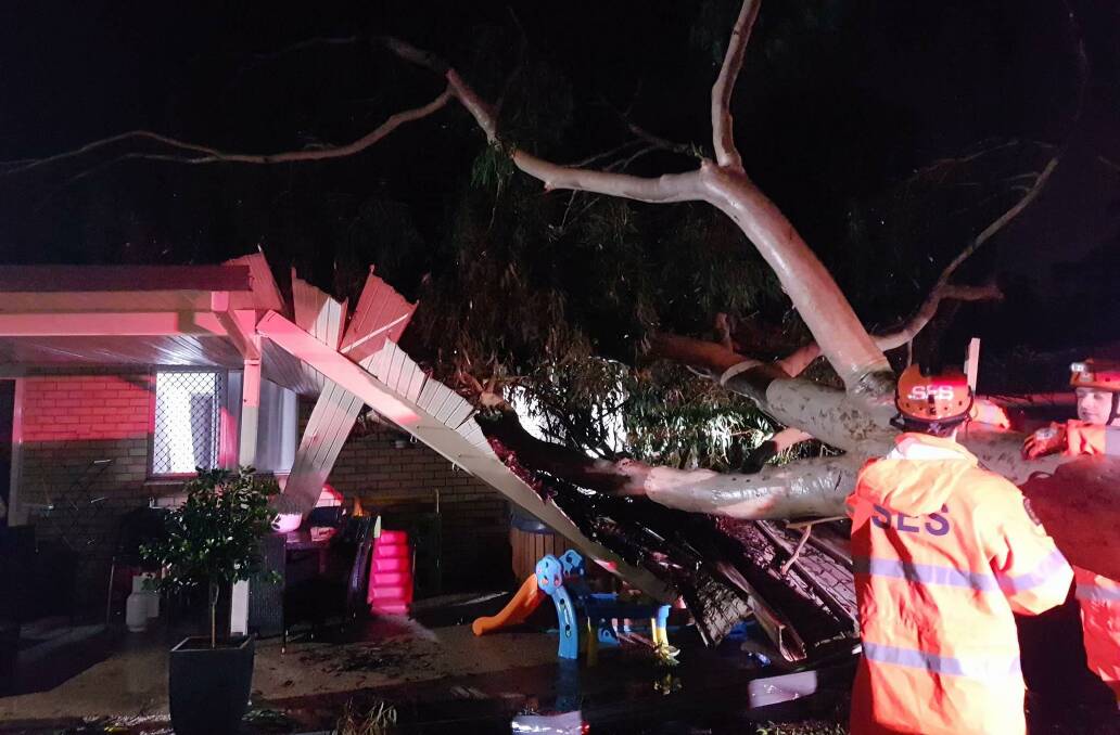 STORM DAMAGE: A house at Capalaba damaged by a tree falling during the storm.