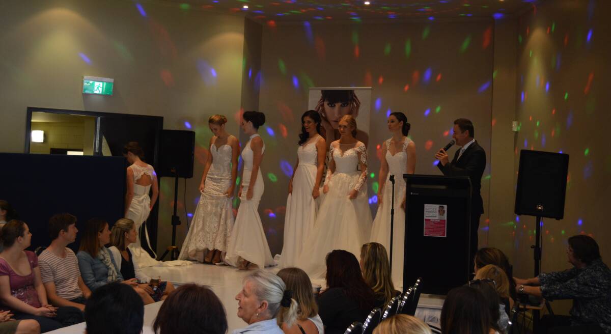 beautiful brides: The ladies exit the stage at the bridal expo.
