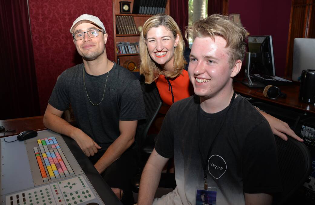 Hip hop performer Illy, Families minister Sshannon Fentiman and song writer Travis Lord in the recording studio. 