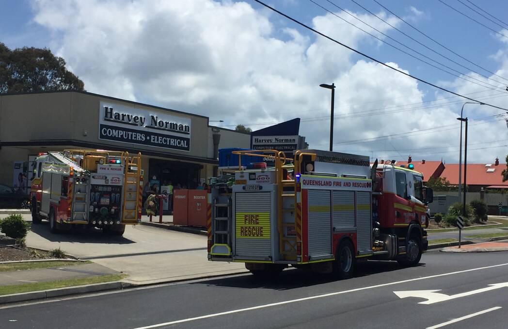 SUSPECTED FIRE: Fire brigade vehicles at the Harvey Norman store on Wellington Street.
