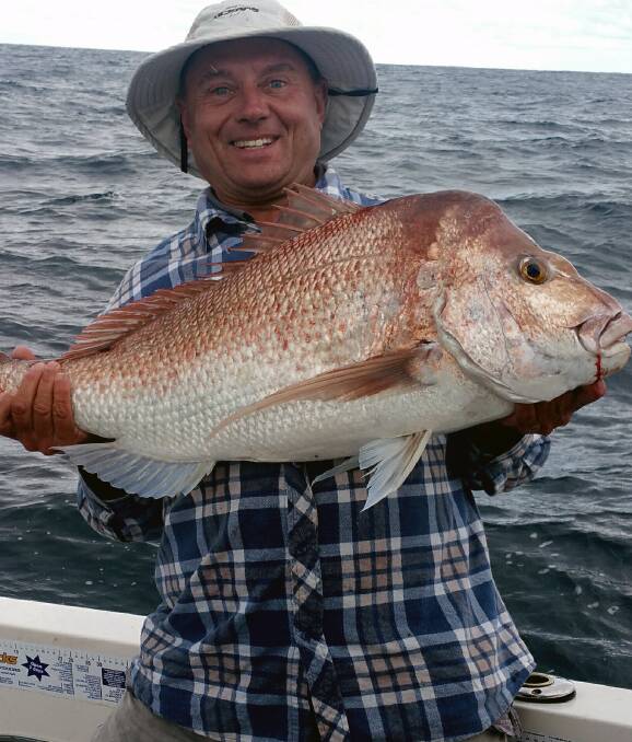 BIG NOBBY: Eric Frei with a 94cm snapper that he caught off Mooloolaba on the Sunshine Coast. There's plenty of dirty water around due to the rain.