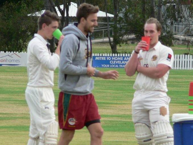 EFFORT: Redlands batsman Brandon James, right, enjoys a well earned drink after scoring a century in the 5th Grade game against Valleys. Picture: Mark French