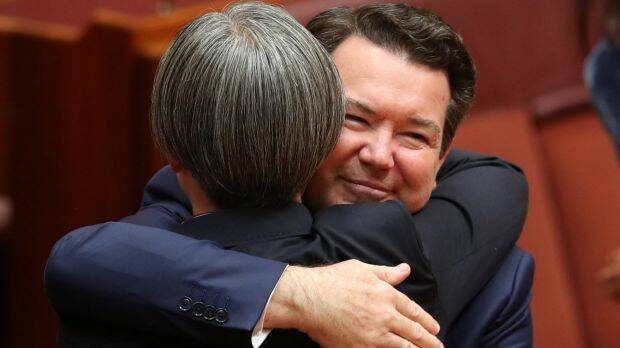 Senator Penny Wong is hugged by co-sponsor Senator Dean Smith earlier this month. Photo: Andrew Meares
