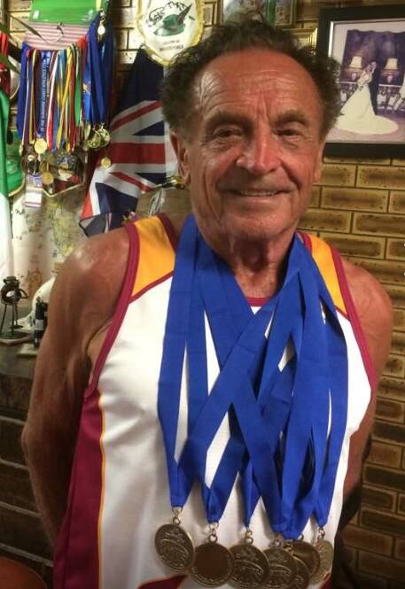 Draped in glory: Pio Bunin with medals won at a meeting earlier this year. Photo: Supplied
