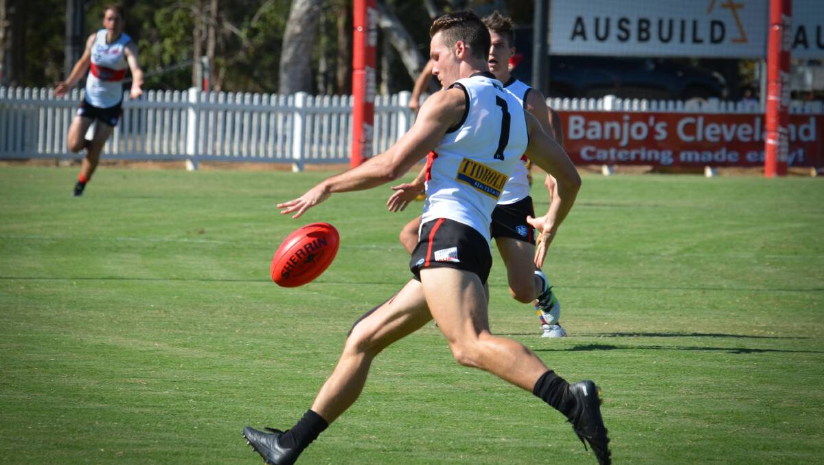 Redland Bombers player Luke Rogerson shapes to kick in a recent match for the Bombers. Photos by Highflyer Images.