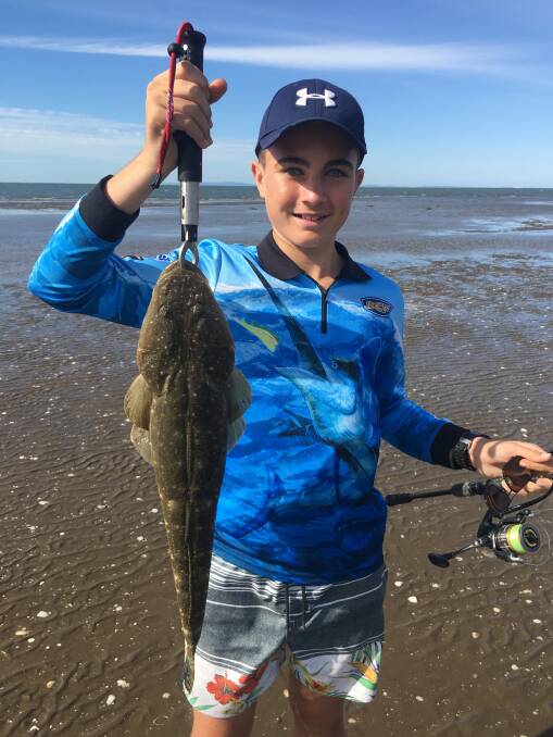 On the hook: Ethan Hall with a 68cm flathead caught from his kayak near Nudgee. Photo: Supplied