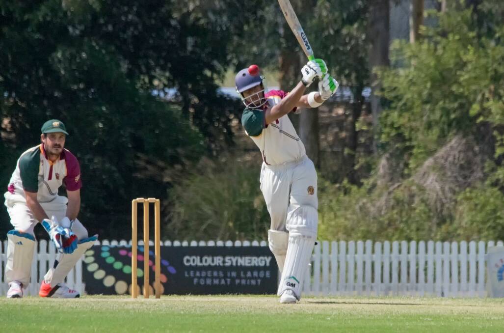 Slogged: Raghav Goel comes forward to hit the ball out into the outfield for Redlands Tigers on the weekend. Photo: Doug O'Neill