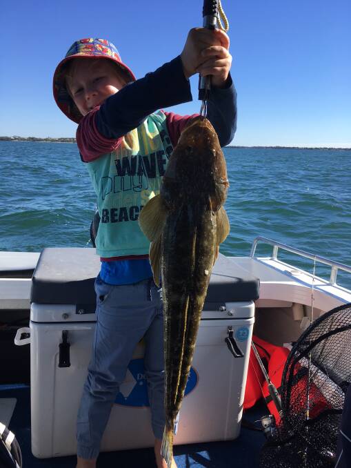 Big Catch: Connor Smith with a 70cm flathead he caught on a lure while out fishing off Bribie Island. Photo: Supplied