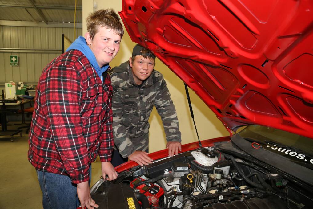 OPPORTUNITY: Khristian Tailby and Ryan Chatfield working on a vehicle in the TAFE NSW Mount Panorama Motorsport Training Centre. Photo: Contributed