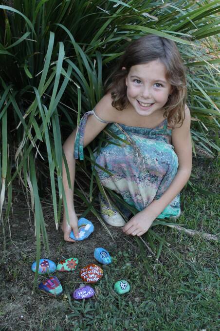 ROCK FUN: Eight-year-old Abbey Spencer hopes other children will find the rocks she is hiding at Mount Cotton park. Photo: Cheryl Goodenough