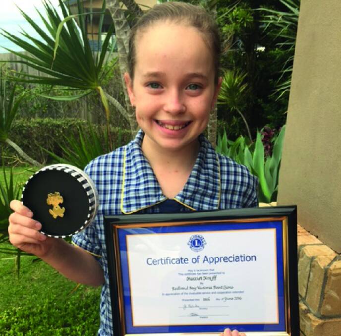 QUEEN OF RAFFLE TICKETS: Faith Lutheran College year 5 student Harriet Knijff received a certificate of appreciation for her service to the Lions Club.