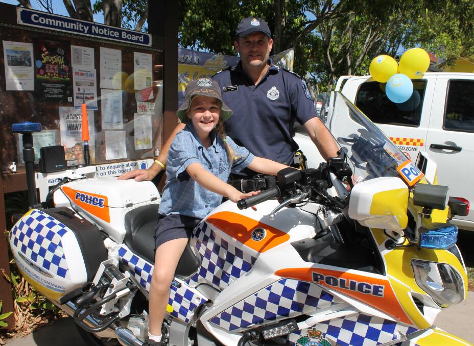 ROAD SAFETY WEEK: Lucy Bryett, 7, with Senior Constable Rik Jackson at the Road Safety Week Coffee with a Cop last year. Photo: Cheryl Goodenough