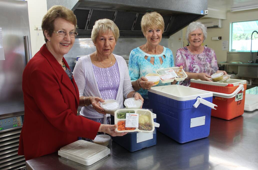 VOLUNTEERS: Meals of Wheels Cleveland president Val Lovett, volunteers Leah Wilson and Hilary Cliffe and volunteer and committee member Magda Clark prepare meals to deliver. Photo: Cheryl Goodenough