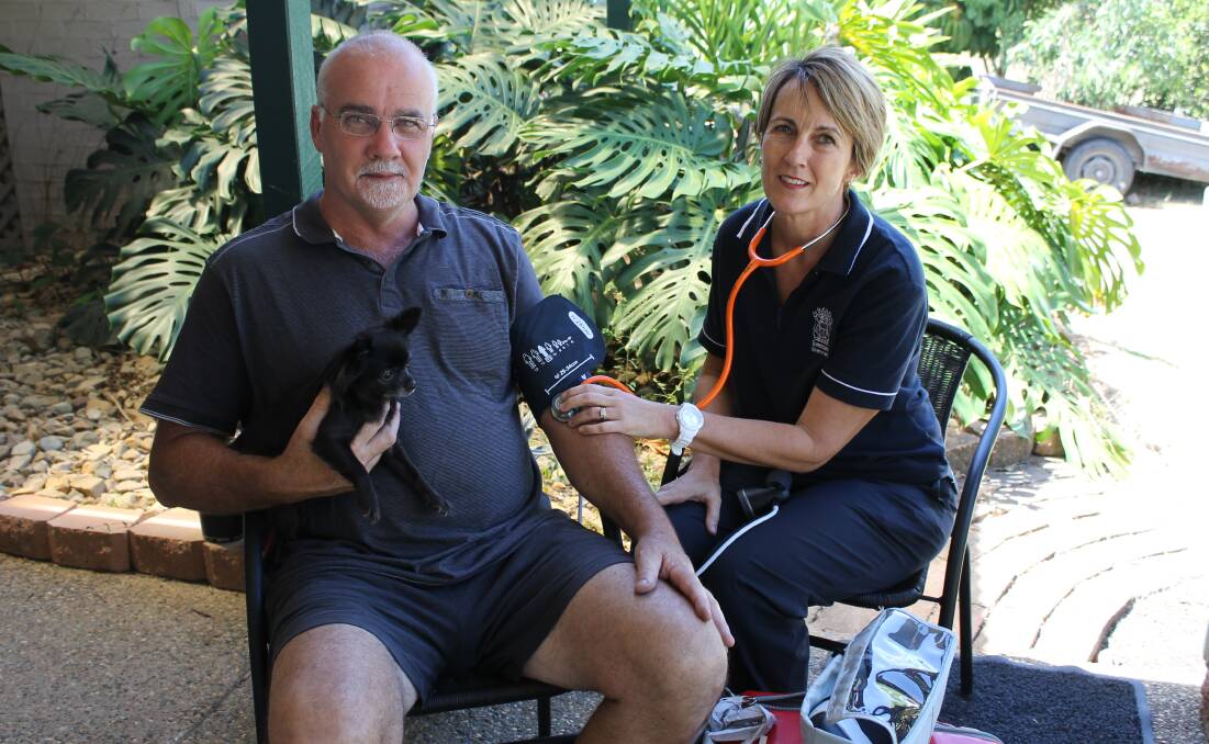 HOME PATIENT: Patrick Bell, of Mount Cotton, is cared for by clinical nurse Sandra Laffranchi. Photo: Cheryl Goodenough