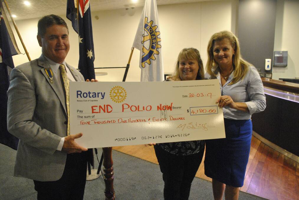 DONATION: Rotarian Shannon McCarthy (middle) and mayor Karen Williams with Rotary District Governor Doug St Clair. Photo: Supplied