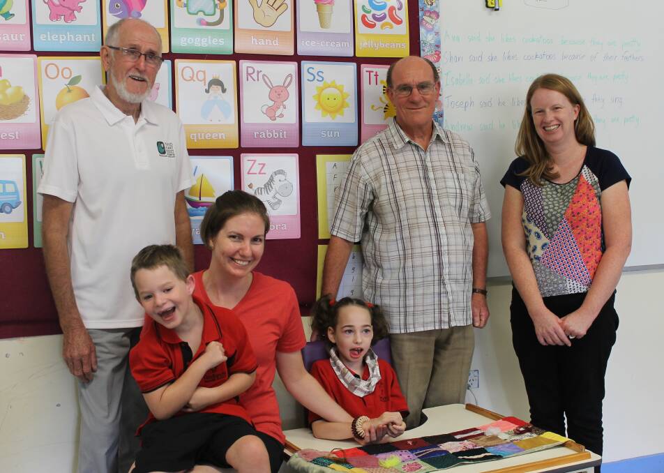 Helping others: Secretary Ken Rose and master John Craigie of the Redlands Masonic Lodge 252 with students Andrew Morris and Ava Larder, and staff members Christie O'Connell and Sheryn Wescott of Redlands Special School. Photo: Cheryl Goodenough