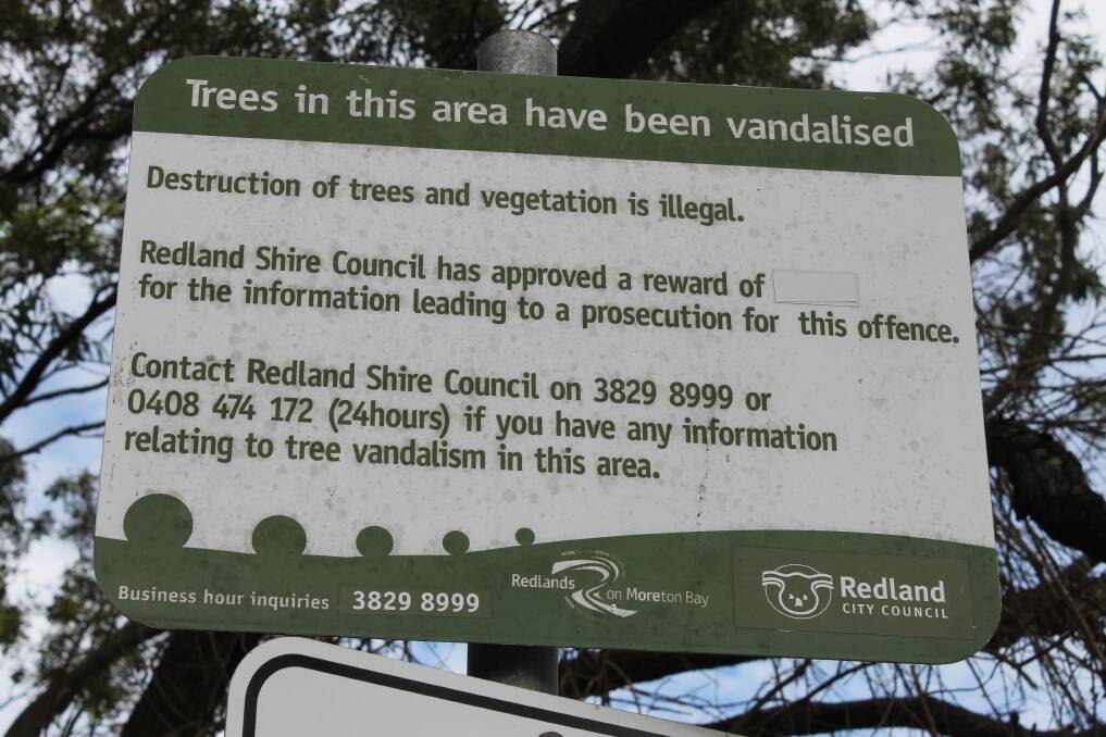 WARNING: Redland City Council signage near Geoff Skinner Wetland in Wellington Point warns that it is illegal to damage marine plants. 