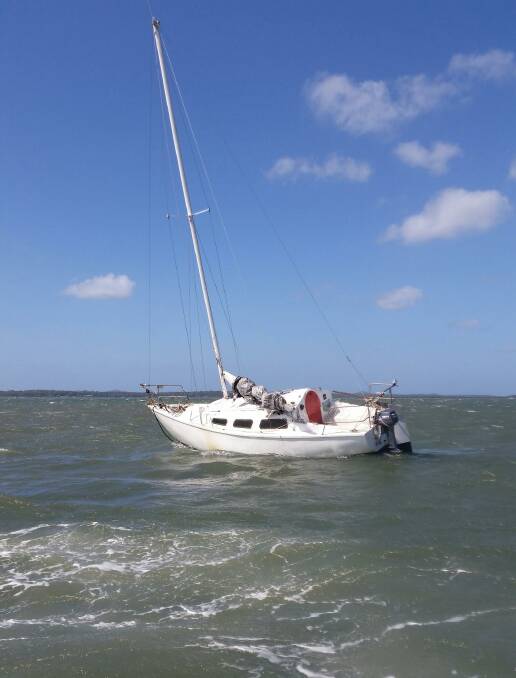Lashing winds: A yacht ran aground in windy conditions near Victoria Point on Sunday. Photo: Redland Bay Coast Guard