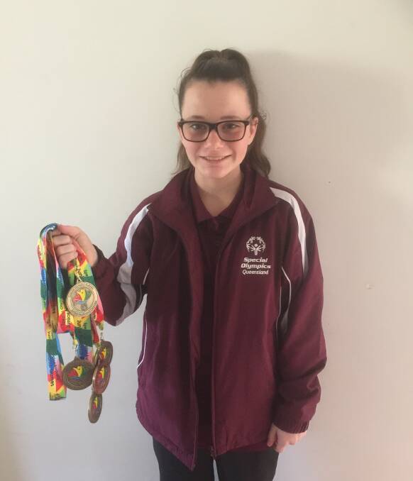 MEDALLIST: Rylee Grier-Stralow with the medals she won for swimming and basketball at the Junior National Games. Photo: Supplied