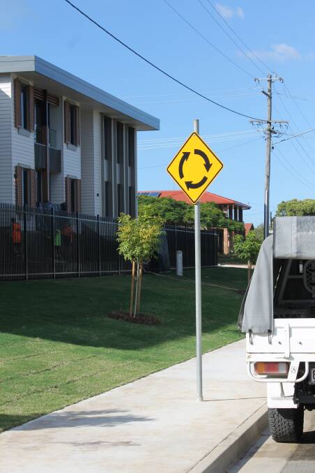 BEFORE: Developers installed a footpath around a road sign in front of an aged care facility under construction at Cleveland. Photo: Cheryl Goodenough