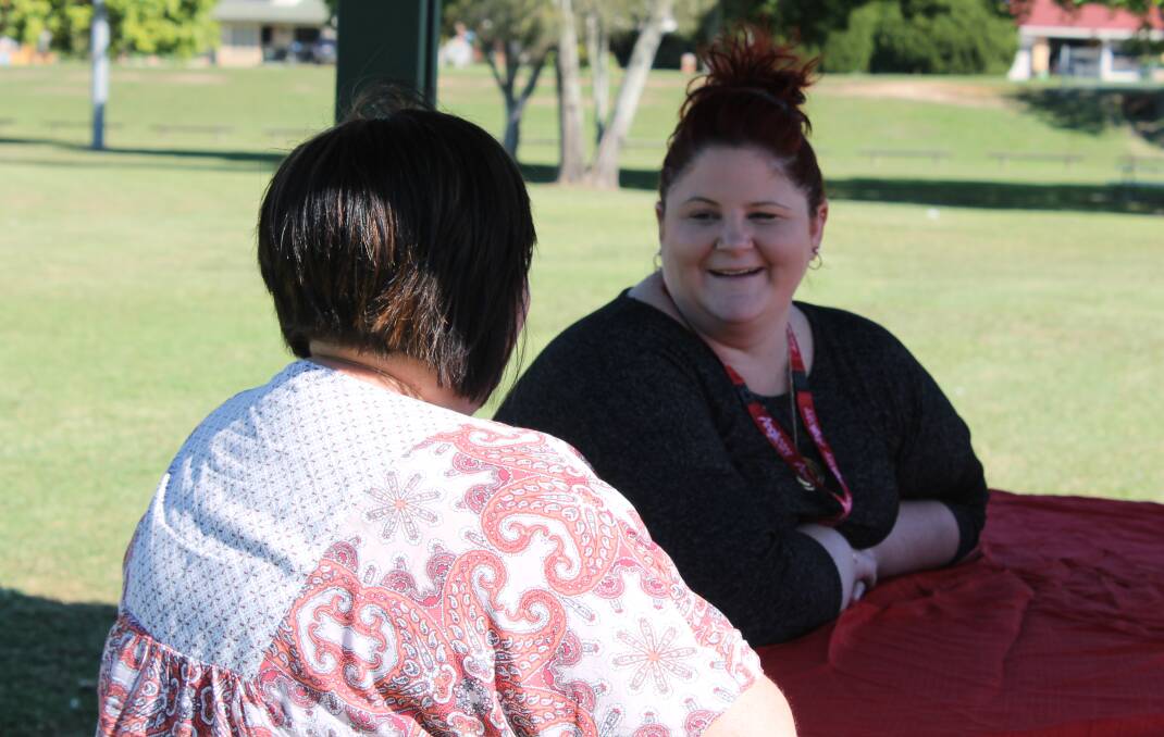 MEETING A NEED: Anglicare Logan case worker Brooke Prickett talks to a Redlands-based foster carer. Photo: Cheryl Goodenough