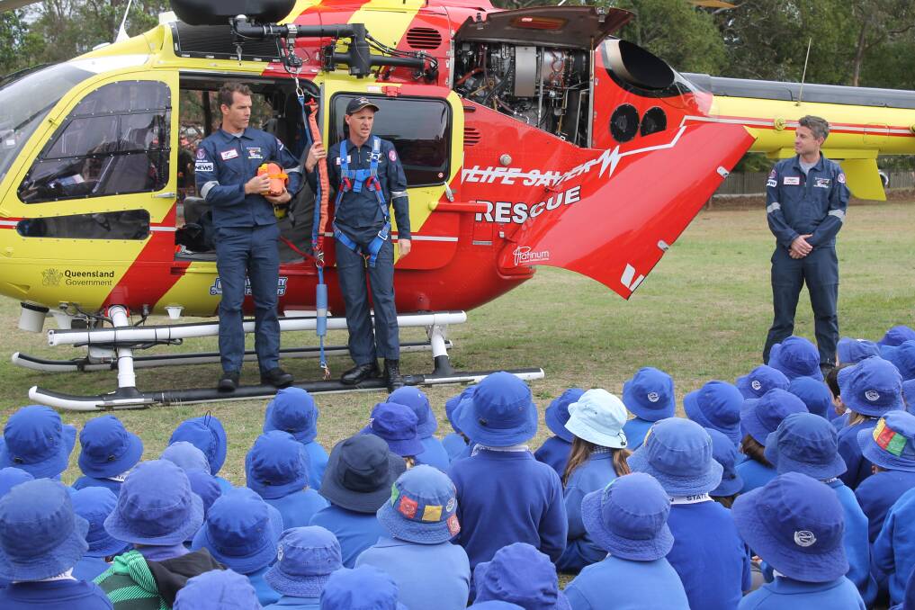ORMISTON VISIT: The pilot and crew talk to students at Ormiston State School about their work on the Westpac Lifesaver Rescue Helicopter. Photo: Cheryl Goodenough